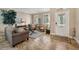Cozy living room with tile flooring, neutral color scheme, and a decorative glass front door at 2116 Truffle Ln, Casselberry, FL 32707