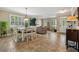 Open-concept living space with tile floors, formal dining area, and view of the front door at 2116 Truffle Ln, Casselberry, FL 32707
