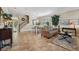 Bright living room with tile floors, dining area, staircase and neutral paint color at 2116 Truffle Ln, Casselberry, FL 32707