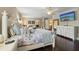 Spacious main bedroom with dark wood floors, a ceiling fan, and a TV with a white dresser at 2116 Truffle Ln, Casselberry, FL 32707