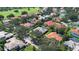 Residential home with a pool is nestled within a neighborhood of other houses at 2232 Lake Vilma Dr, Orlando, FL 32835