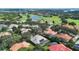Aerial shot of homes with pools and the surrounding lush community at 2232 Lake Vilma Dr, Orlando, FL 32835