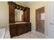 Bathroom showcasing vanity with granite countertops and a modern glass shower enclosure at 2232 Lake Vilma Dr, Orlando, FL 32835