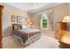 Cozy bedroom with plush carpet, natural light, and traditional furnishings at 2232 Lake Vilma Dr, Orlando, FL 32835