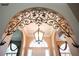 Detailed shot of the foyer featuring decorative archway, chandelier, and inviting entryway at 2232 Lake Vilma Dr, Orlando, FL 32835