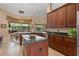 Gourmet kitchen with stainless appliances, dark cabinets and tile floors, great for entertaining at 2232 Lake Vilma Dr, Orlando, FL 32835