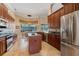 Gourmet kitchen with stainless appliances, dark cabinets and tile floors, great for entertaining at 2232 Lake Vilma Dr, Orlando, FL 32835