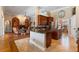 Spacious kitchen with dark wood cabinets, granite countertops, and a central island that opens up to the living room at 2232 Lake Vilma Dr, Orlando, FL 32835