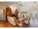 A spacious living room has hardwood floors, comfortable seating, custom shelving, and an arched doorway at 2232 Lake Vilma Dr, Orlando, FL 32835