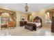 Comfortable main bedroom with luxury furnishings, and decorative window treatments at 2232 Lake Vilma Dr, Orlando, FL 32835