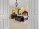 Stunning main bedroom boasts a chandelier, elegant furniture, and a luxurious ambiance at 2232 Lake Vilma Dr, Orlando, FL 32835