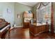 Comfortable office space includes a large desk, hutch, and musical instruments on wood floors at 2232 Lake Vilma Dr, Orlando, FL 32835
