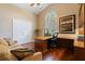Bright office features wood floors, built-in desk, and large window with great natural light at 2232 Lake Vilma Dr, Orlando, FL 32835