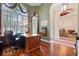 Well-appointed home office features wood floors, custom built-ins, and ample natural light at 2232 Lake Vilma Dr, Orlando, FL 32835