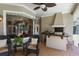 Inviting outdoor kitchen with built-in grill, granite countertop, and comfortable seating for entertaining guests at 2232 Lake Vilma Dr, Orlando, FL 32835