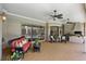 The covered patio features comfortable seating and outdoor living space with views of the backyard at 2232 Lake Vilma Dr, Orlando, FL 32835