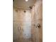 Deluxe walk-in shower features a rainfall shower head, multiple shower heads, and mosaic tile accents at 2232 Lake Vilma Dr, Orlando, FL 32835