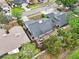 Aerial view showcasing the home's backyard deck, landscaping, roof, and neighborhood surroundings at 2260 Winslow Cir, Casselberry, FL 32707