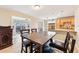 Dining area with view into the kitchen and glass sliding doors to the exterior at 2260 Winslow Cir, Casselberry, FL 32707