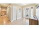 Bright foyer with tile flooring, closet, and front door with decorative glass at 2260 Winslow Cir, Casselberry, FL 32707