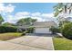 Charming single story home with an attached two-car garage and well-manicured front yard at 2260 Winslow Cir, Casselberry, FL 32707