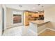 Bright kitchen features wooden cabinetry, tile backsplash, granite counters, and a breakfast bar at 2260 Winslow Cir, Casselberry, FL 32707