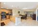 Open concept kitchen with a granite island flows into a dining area and living space at 2260 Winslow Cir, Casselberry, FL 32707