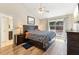 The main bedroom boasts a wood accent wall, access to the backyard, and an ensuite bathroom at 2260 Winslow Cir, Casselberry, FL 32707