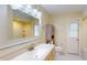 A bathroom features a vanity with solid surface counters and an enclosed tub-shower at 2369 Haulover Blvd, Deltona, FL 32738