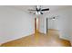 Empty bedroom with tile floor, ceiling fan and a closet with mirrored sliding doors at 2369 Haulover Blvd, Deltona, FL 32738