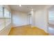 Bright bedroom featuring tile floors, white walls, and mirrored closet doors at 2369 Haulover Blvd, Deltona, FL 32738