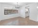 Bright dining room with a chandelier and view of a swimming pool through the window at 2369 Haulover Blvd, Deltona, FL 32738