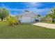 Charming single-Gathering home with a well-manicured front yard and attached garage at 2369 Haulover Blvd, Deltona, FL 32738