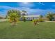 Well-maintained home with lush lawn and tropical landscaping at 2369 Haulover Blvd, Deltona, FL 32738