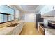 Open kitchen featuring granite countertops, stainless steel appliances, and white cabinets at 2369 Haulover Blvd, Deltona, FL 32738