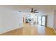 Open living space with tile floors, ceiling fan, and sliding doors offering a view of the outdoor area at 2369 Haulover Blvd, Deltona, FL 32738