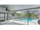 Screened-in pool area with a ceiling fan for added comfort at 2369 Haulover Blvd, Deltona, FL 32738