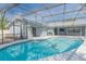 Sparkling pool enclosed with screened lanai for relaxing outdoors at 2369 Haulover Blvd, Deltona, FL 32738