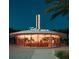 Exterior of a round Foxtail Coffee shop with neon lights at dusk at 2378 Addalia Aly, Orlando, FL 32804