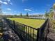 View of the community dog park with fencing and landscaping at 2378 Addalia Aly, Orlando, FL 32804