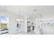 Modern kitchen with stainless steel appliances, a center island, and bright dining area at 2378 Addalia Aly, Orlando, FL 32804