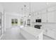 Modern kitchen with large center island, stainless steel appliances, and ample cabinet space at 2378 Addalia Aly, Orlando, FL 32804