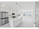 Modern kitchen with a large center island, stainless steel appliances and open to living space at 2378 Addalia Aly, Orlando, FL 32804