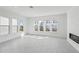 Bright open living space with modern tile flooring, gas fireplace, and many windows at 2378 Addalia Aly, Orlando, FL 32804