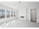 Bright open living space with modern tile flooring, gas fireplace, and many windows at 2378 Addalia Aly, Orlando, FL 32804
