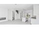 Open-concept living space boasts modern design with sleek fireplace and staircase at 2378 Addalia Aly, Orlando, FL 32804