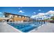 Exterior view of community pool at the Packing District with blue and white decor and lifeguard chair at 2378 Addalia Aly, Orlando, FL 32804