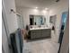 Spacious bathroom featuring a double sink vanity and a shower at 2711 Neverland Dr, New Smyrna Beach, FL 32168