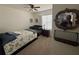 Cozy bedroom with a ceiling fan, neutral walls, and a small crib at 2711 Neverland Dr, New Smyrna Beach, FL 32168
