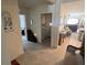 Open entryway showcasing the living room and laundry room with neutral tiled floors at 2711 Neverland Dr, New Smyrna Beach, FL 32168